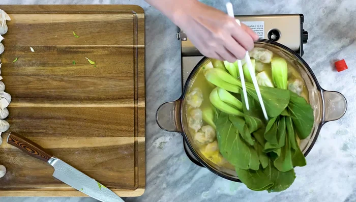 Add baby bok choy during the last 20 seconds to 1 minute of cooking.