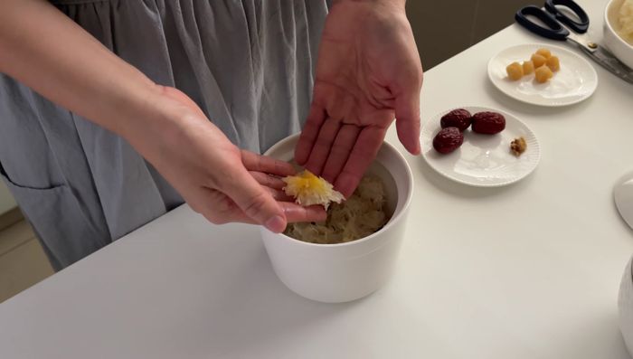 Add two small pieces of chicken (about 120g) to each bowl. Repeat for all four bowls.