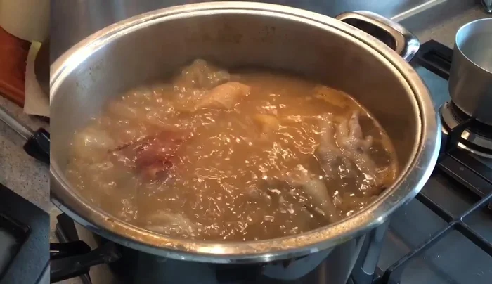 Transfer some soup to a smaller pot. Add ginger, cabbage, tomatoes, and egg tofu. Bring to a boil.