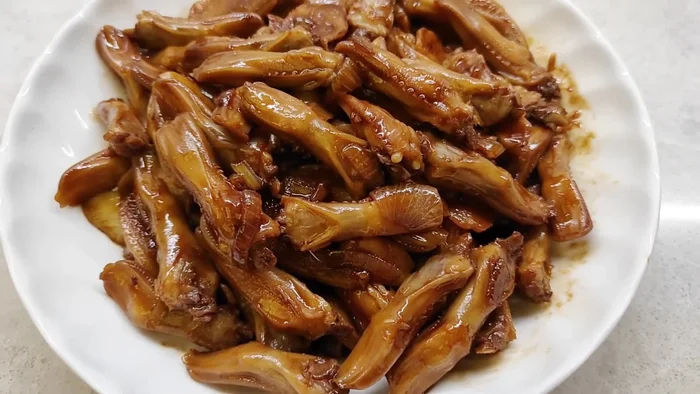 Marinate the duck tongues in a mixture of salt, soy sauce, sugar, five-spice powder, minced ginger, and minced garlic. Let them marinate for at least 30 minutes (or longer for a more intense flavor).