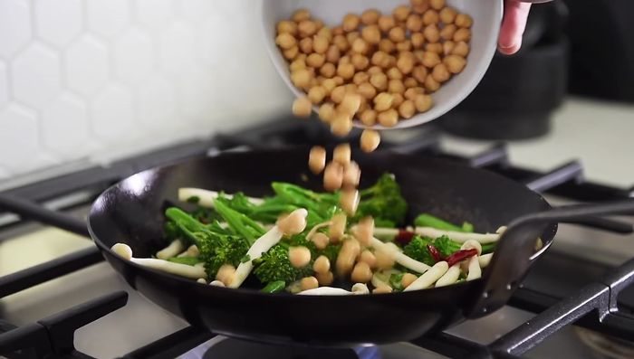 Add chickpeas and sauté for a short while.