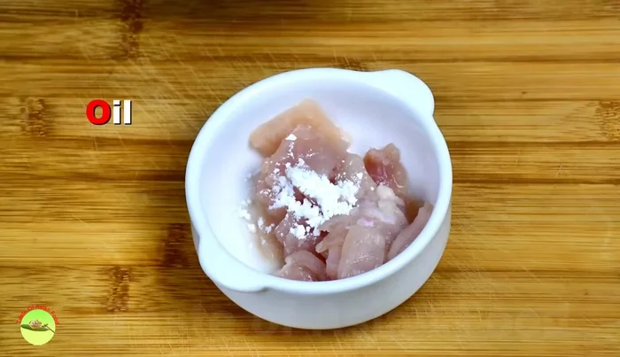 Marinate chicken with corn flour, oyster sauce, and light soy sauce for at least 30 minutes.