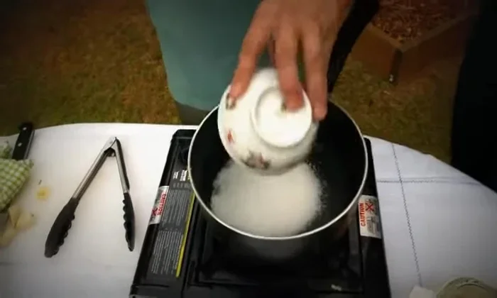 Cook 120g of white sugar until caramelized.