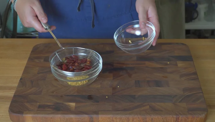 Prepare aromatics: Cut and de-seed dried chilies. Grind or break up dried orange peels. Prepare extra garlic, ginger, and scallions.