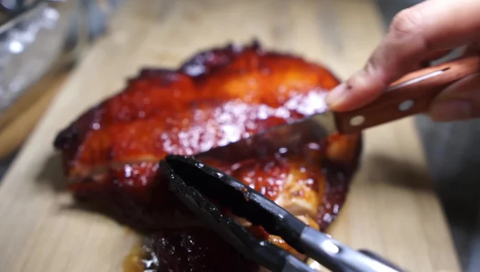 Serve: Once the chicken is cooked, remove it from the oven. Drizzle with the char siu sauce and serve with rice (optional).