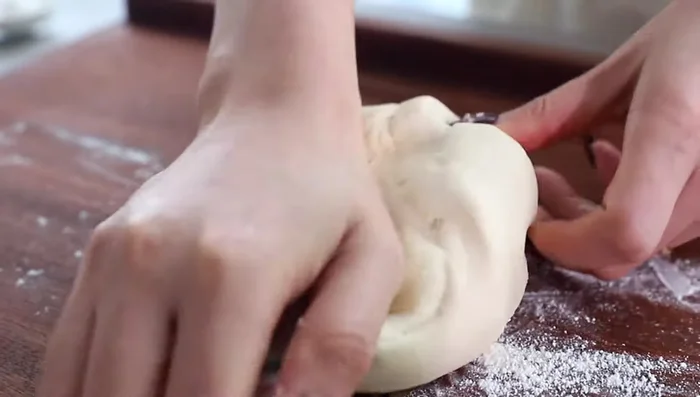 Lightly dust a surface with flour, knead the dough again, and place it in a smooth bowl. (Dough temperature should be below 28°C)