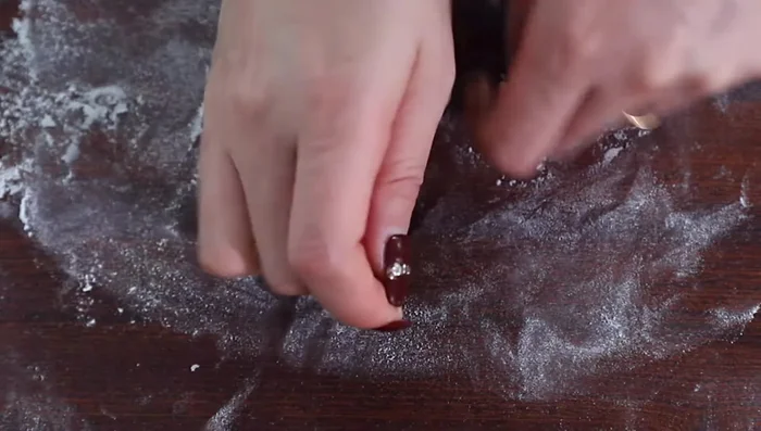 Take one portion, shape it into a round ball, and let it rest for a couple of minutes.