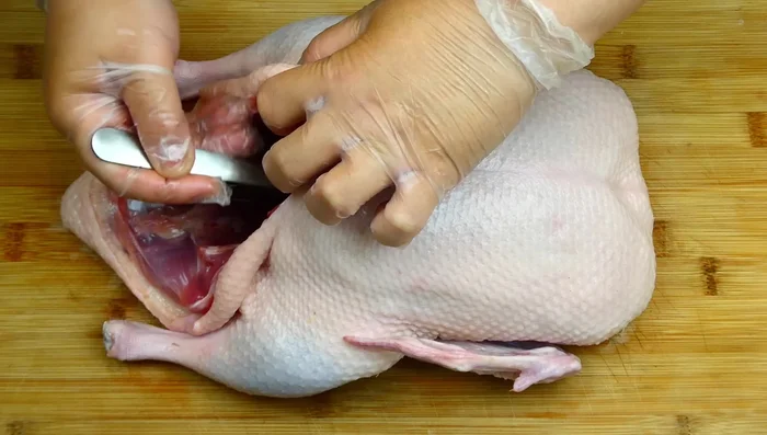 Rub the inside of the duck with the seasoning mix and sauce.