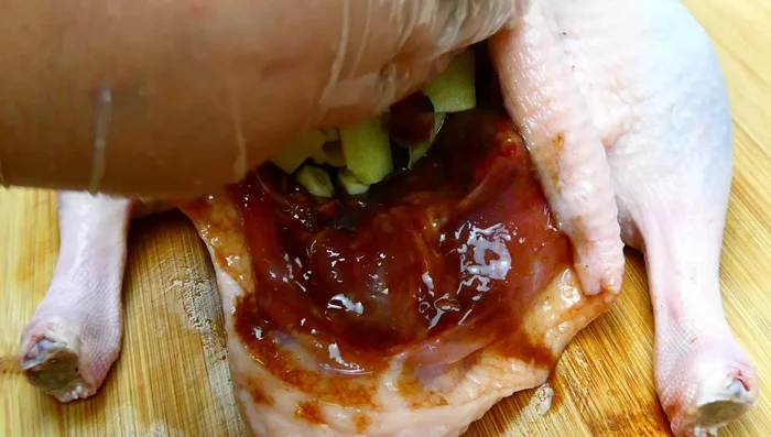 Stuff the ginger, garlic, and star anise inside the duck.