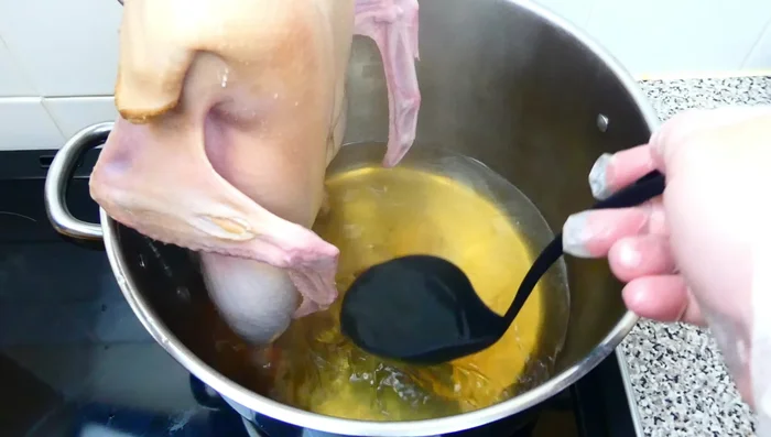 Pour boiling water over the duck, ensuring all sides are covered.
