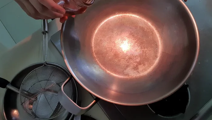 Pan-fry the lobster pieces (mid-side down) for about 3 minutes. Don't worry about browned flour stuck to the pan; it adds flavor.