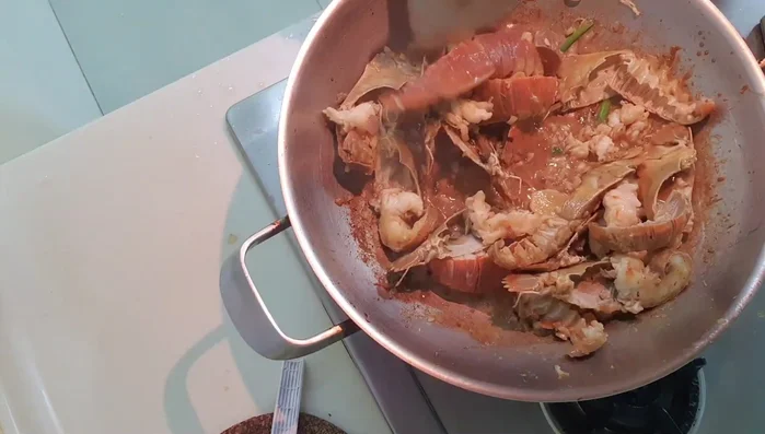 Finally, add remaining spring onions and coriander leaves. Keep stirring until the sauce thickens and coats each piece nicely.