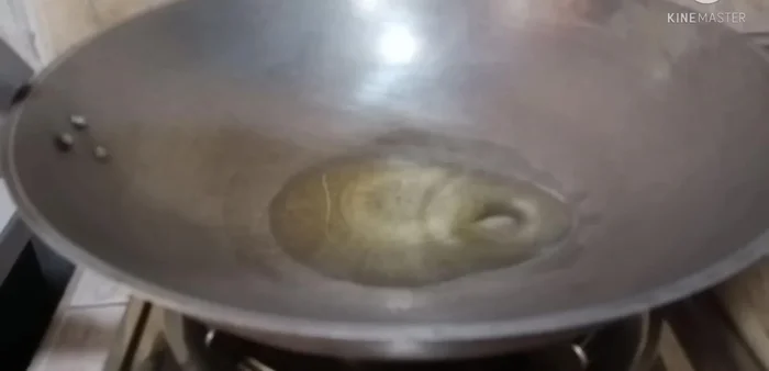 Heat cooking oil in a wok or large frying pan.