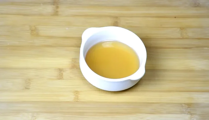 Prepare marinades: Make two marinades. The first marinade consists of honey, soy sauce, and five-spice powder. The second is a dry mix of salt, five-spice powder, and black peppercorns.