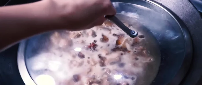 Cover the wok and simmer for 35-40 minutes, or until the water level is reduced by about 1/3. Keep an eye on the water level and add more if necessary.