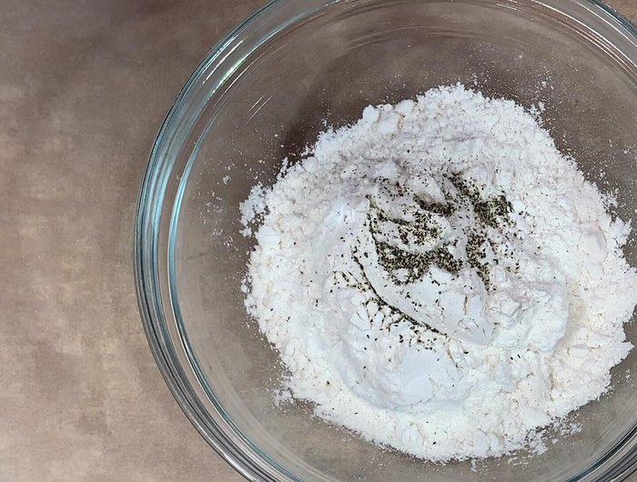Prepare breading stations: Season flour with pepper, onion powder, garlic powder, and Old Bay; beat 2 eggs; and mix panko and regular breadcrumbs with pepper and Old Bay.