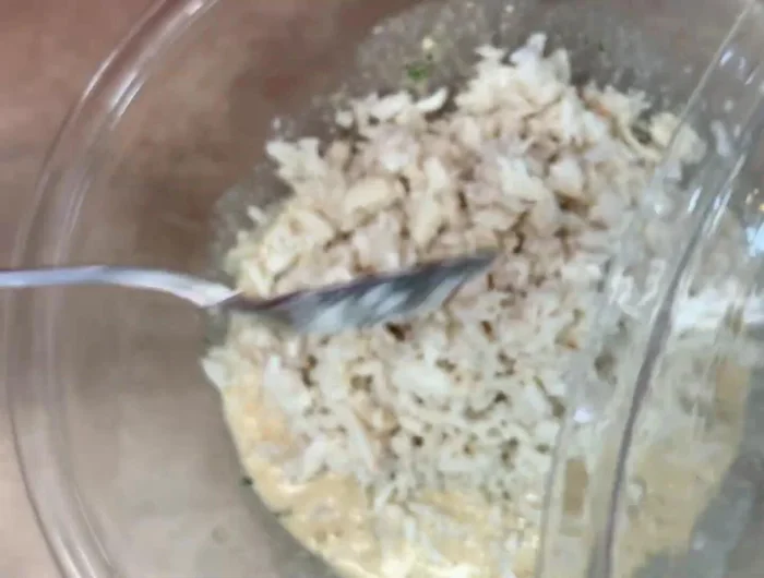 Add crab meat, bread crumbs, sautéed vegetables, and green onions to the bowl. Fold everything together until well combined.