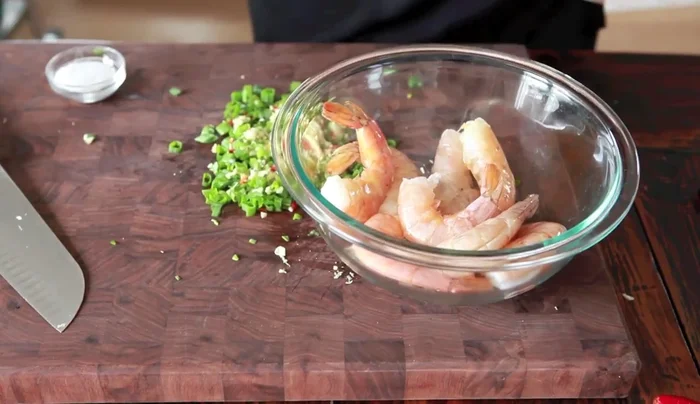 Toss the shrimp with a little bit of oil and season with salt. Add the herb mixture and toss to coat.