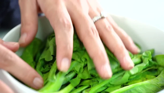 Steam the Chinese broccoli: Steam the Chinese broccoli in the microwave for 2 minutes.