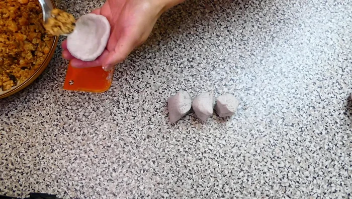 Flatten each dough piece into a round shape, place filling in the middle, fold over, and seal the edges. Repeat for the rest.