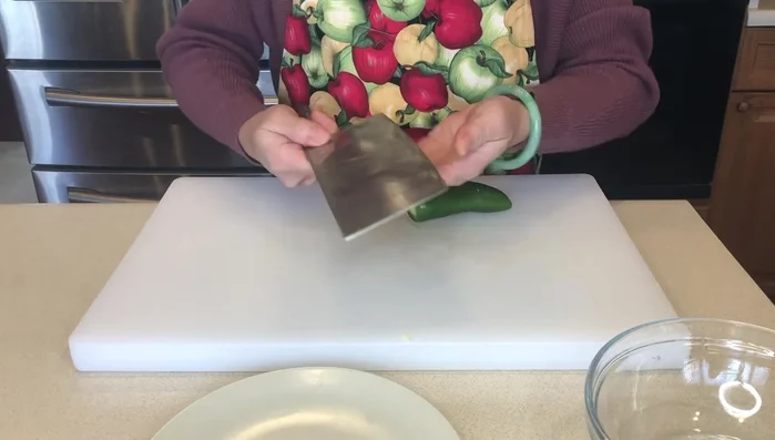 Remove the ends of the jalapeno and slice it.