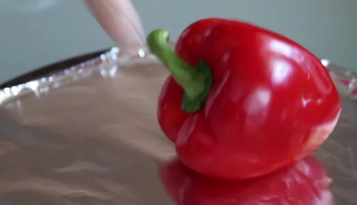 Place peppers on a baking sheet, leaving a few inches of space between them and the heating element.