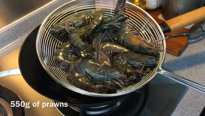 Pat prawns dry and cut them in half lengthwise. Remove veins.