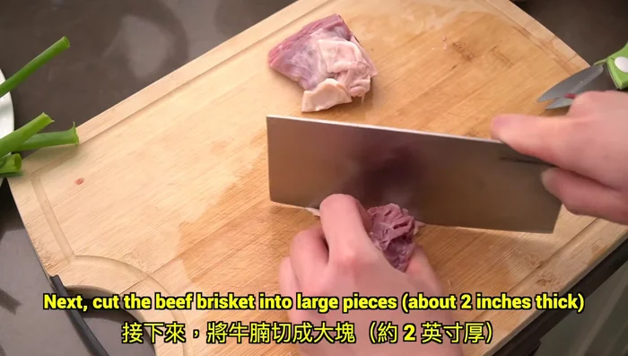 Cut beef brisket into 2-inch thick pieces.