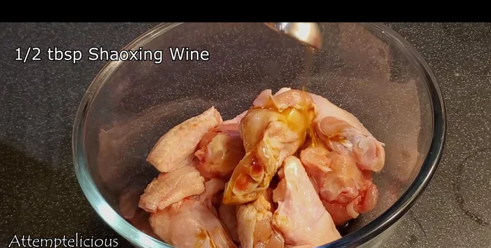 Marinate chicken wings with soya sauce, Shaoxing wine, sesame oil, dark soya sauce, sugar, and pepper for at least 2 hours (longer is better).