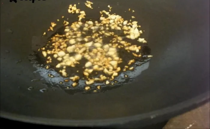 Add the steamed baby bok choy to the pan and stir-fry until coated with the sauce.
