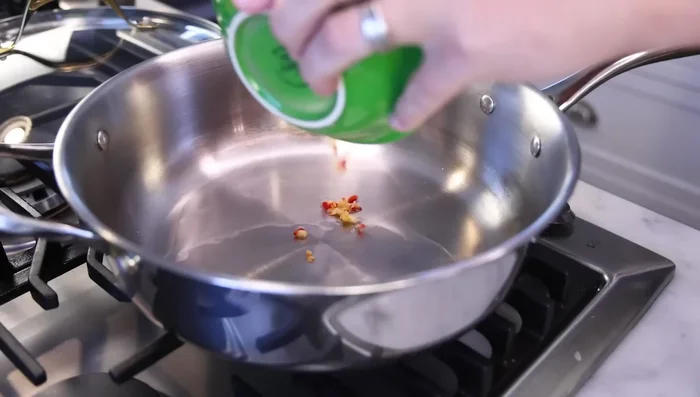 Make the garlic sauce: Heat oil in pan. Fry the garlic, ginger, and chili until softened and slightly golden. Add water/stock, onion powder, soy sauce, vinegar/mustard, oyster sauce/fish sauce/marmite, sugar, molasses, sesame oil, pepper, and five-spice (if using).