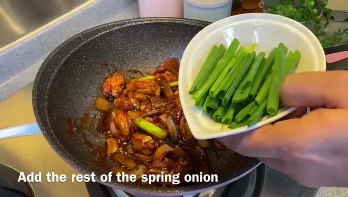 Add remaining spring onion and mix.