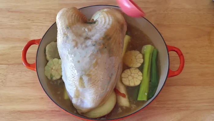 Baste the turkey with the stock. Return to the oven and roast for 30 minutes.