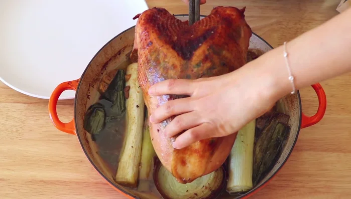 Transfer the turkey to a plate, loosely cover with foil, and let rest for at least 30 minutes before slicing.