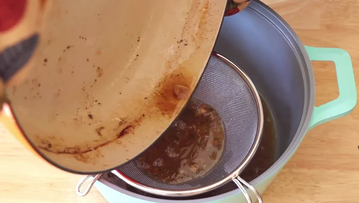 Strain the stock, add chicken stock, vegetable puree, and soy sauce. Bring to a boil.