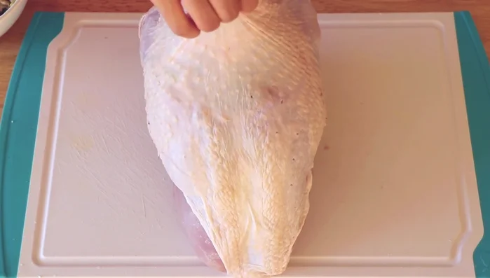 Spread the soy sauce butter mixture under and over the turkey skin. Massage it in.