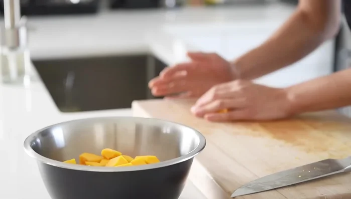 Toss the squash cubes with avocado oil, salt, pepper, and maple syrup. Spread on a parchment-lined baking tray and roast for 35 minutes.
