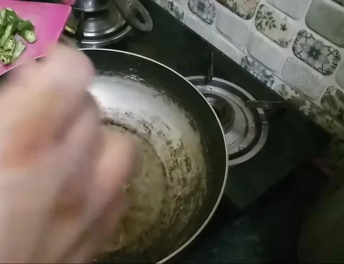 Add garlic and chili to the hot oil.