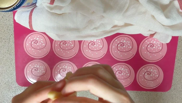 Pinch the ends together. The dough should twist itself.