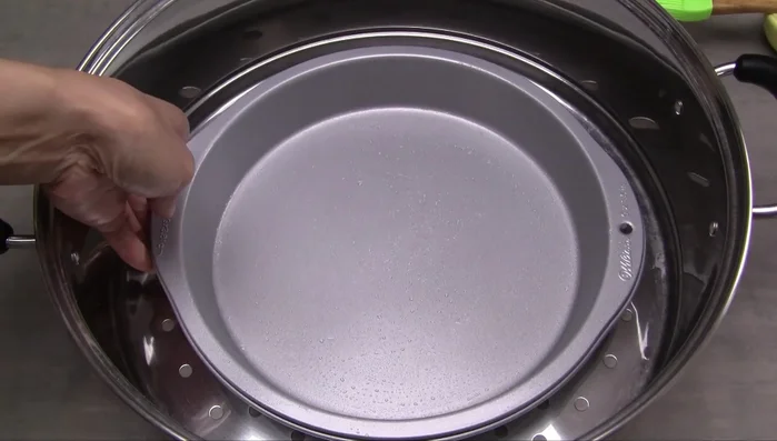 Place the pan in a steamer. Fill the steamer basin halfway with water. Bring to a rapid boil over high heat.