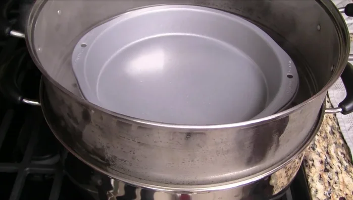 Stir the batter again and pour into the prepared pan. Skim off any large bubbles.