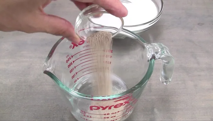 Add active dry yeast and ½ tsp sugar to the warm water. Let rest for 10 minutes until foamy.