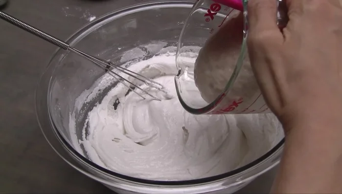 Add the yeast mixture and the sugar-water mixture to the rice flour mixture. Stir well, scraping the bottom and sides of the bowl.