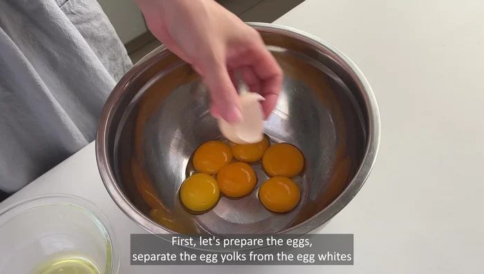 Separate egg yolks from egg whites. Ensure the bowl for egg whites is completely dry.