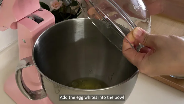 In a dry bowl, whisk egg whites on medium speed until foamy. Gradually add 90g castor sugar in three portions, along with 1 tsp lemon juice, while whisking until stiff peaks form.