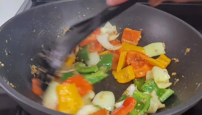 Pour in the prepared sauce and let it thicken for a few seconds. Add water if it becomes too thick.