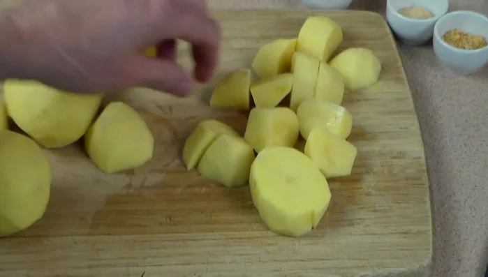Peel and chop potatoes into bite-sized pieces. Make sure they are dry.