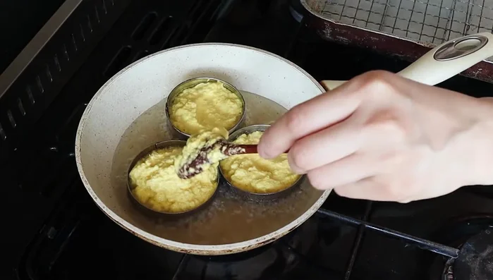 Heat a frying pan to medium-high heat. Pour the corn mash into the pan using cookie cutters or rings to create individual cakes (optional).