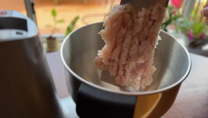 Transfer chopped fish to a mixer (paddle attachment, not slicer). Add salt and water gradually, mixing until well combined. Add fish sauce.