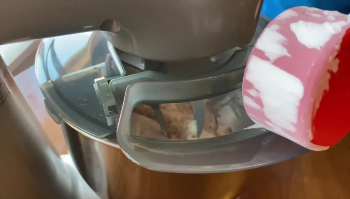 Add sweet potato powder or cornstarch and beat for another 15-20 minutes on medium-high speed until bouncy and moldable.